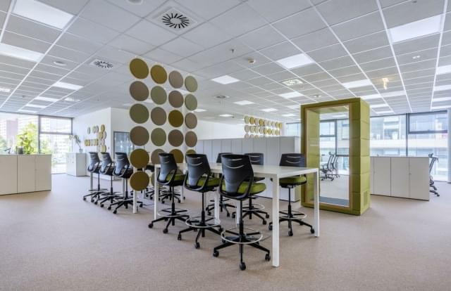 open office with high desks and acoustic elements