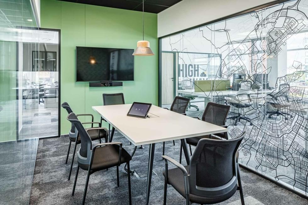meeting room with glass partitions and laminate flooring