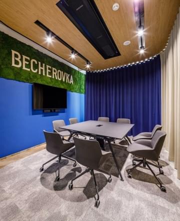 meeting room with moss wall and Becherovka sign
