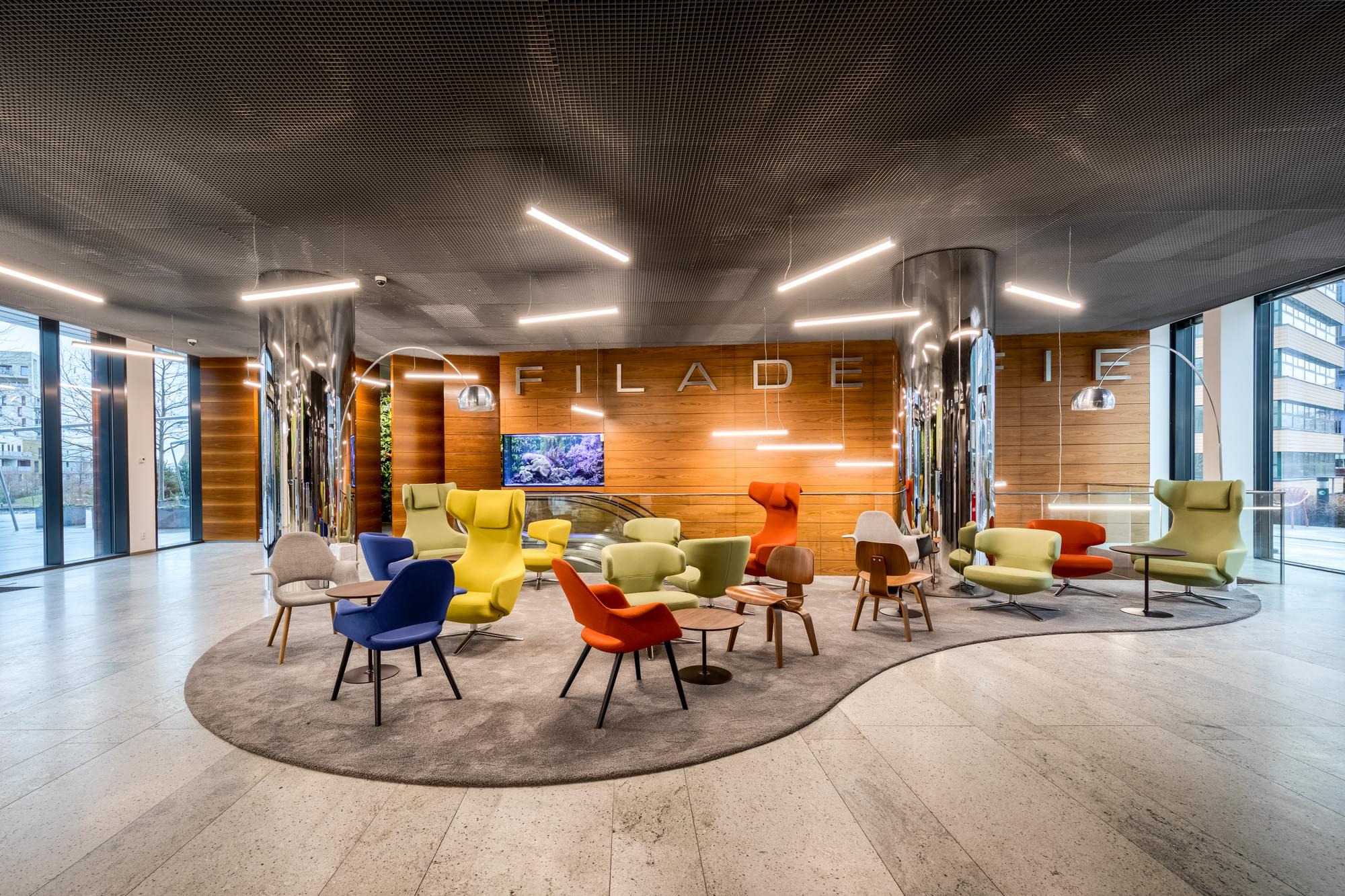 Lobby area with colorful armchairs in a Filadelfia building