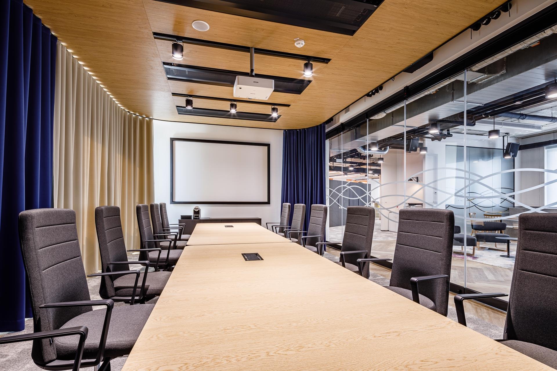 Open meeting room with dividers and ergonomic furniture