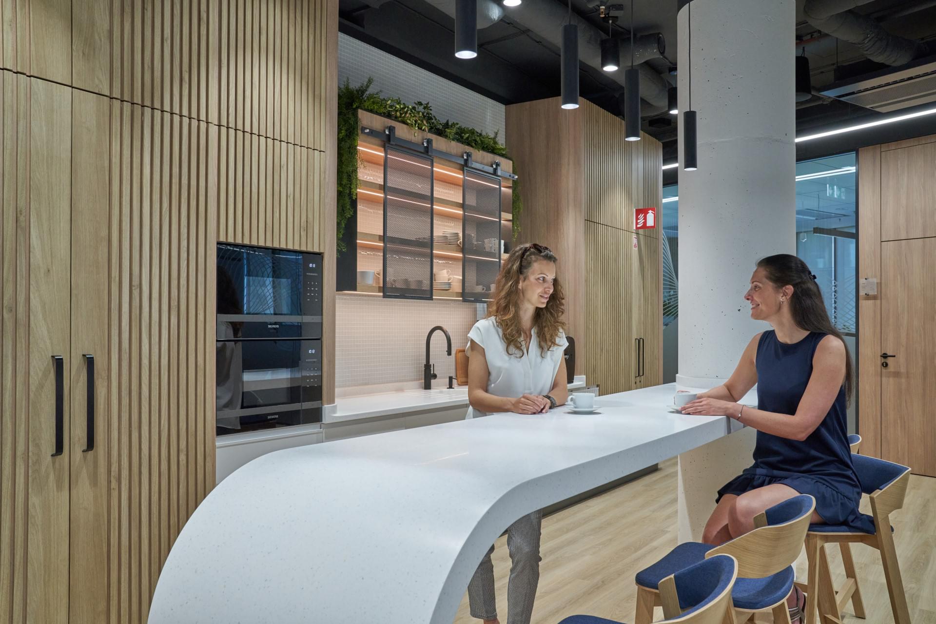 Corporate kitchen with modern equipment in wooden design