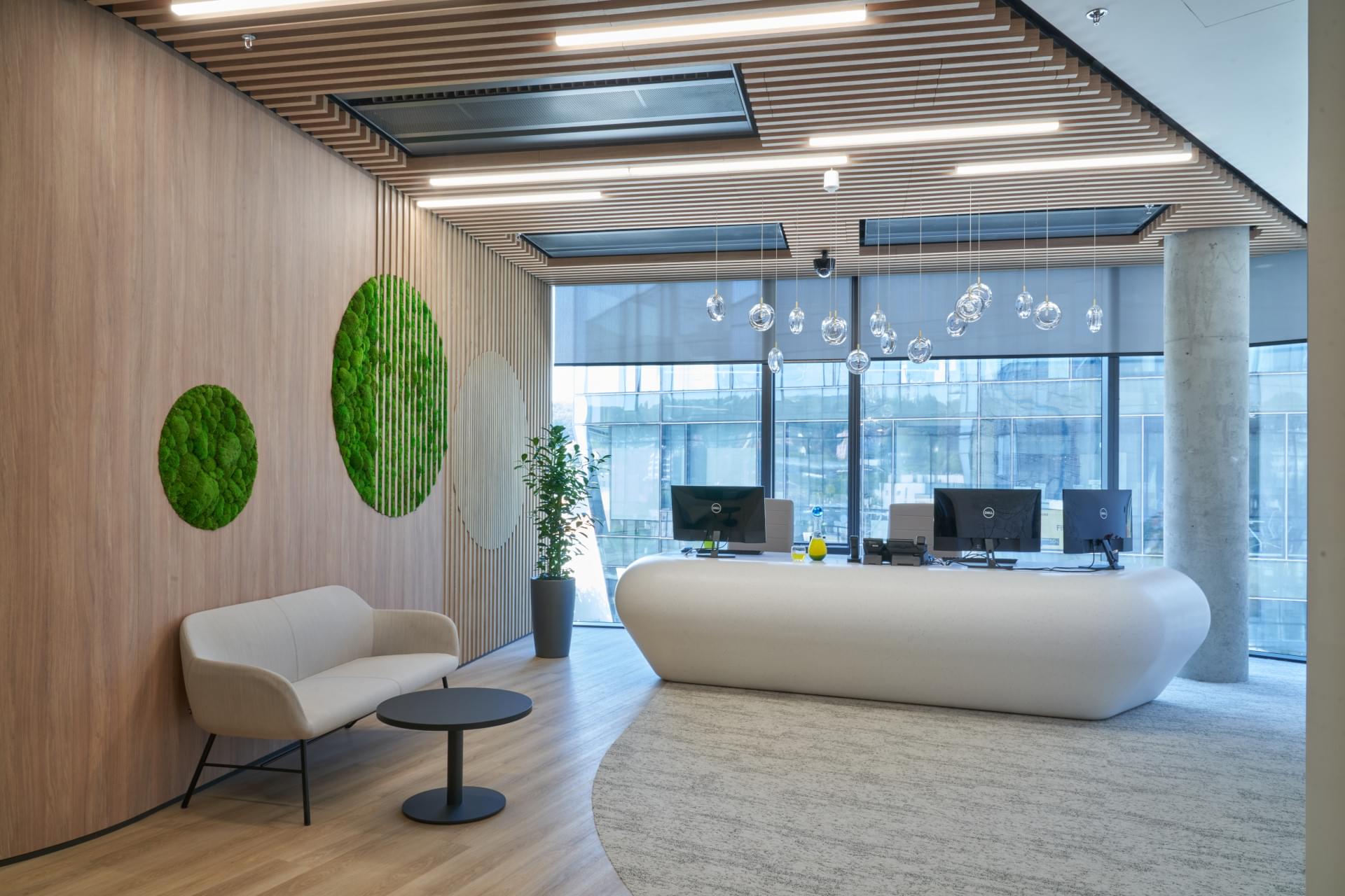 Modern lobby with reception decorated with biophilic elements