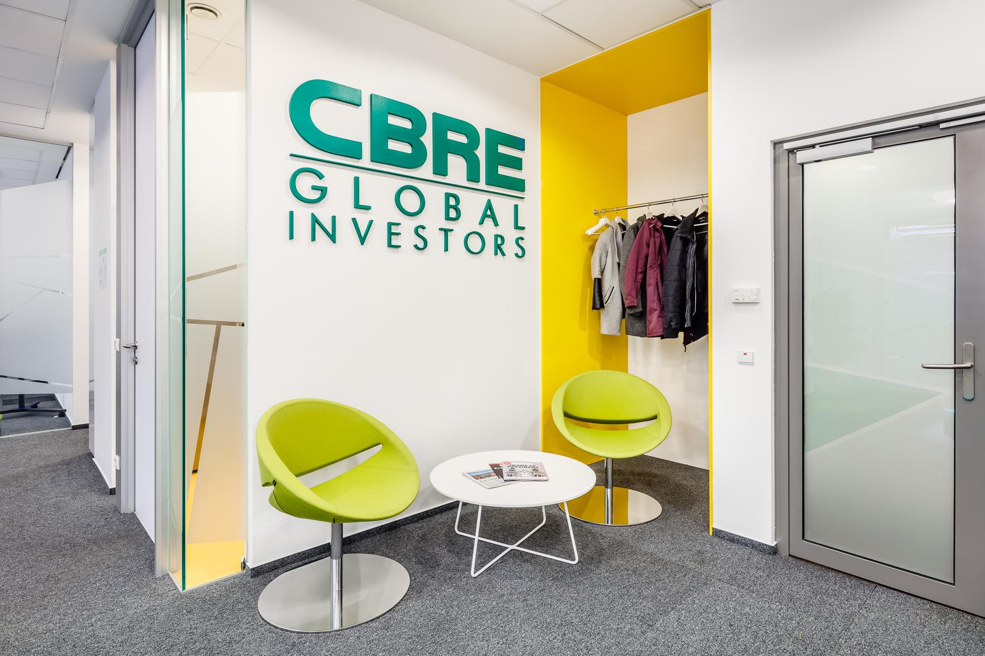 Realization of co-working space with soft seating interior and CBRE logo