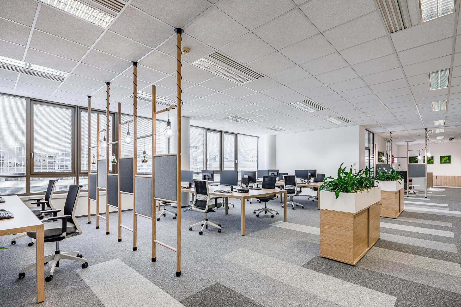Open space offices with acoustic panels in the company Centropol