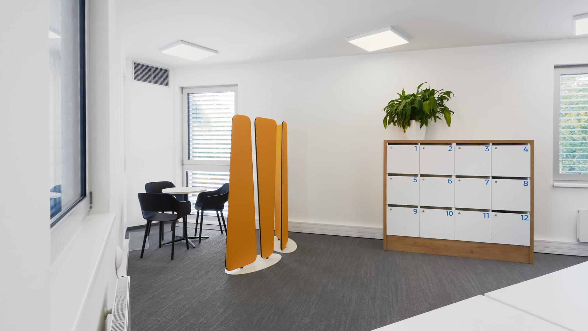 Minimalist space with sliding screens for more privacy at Notix