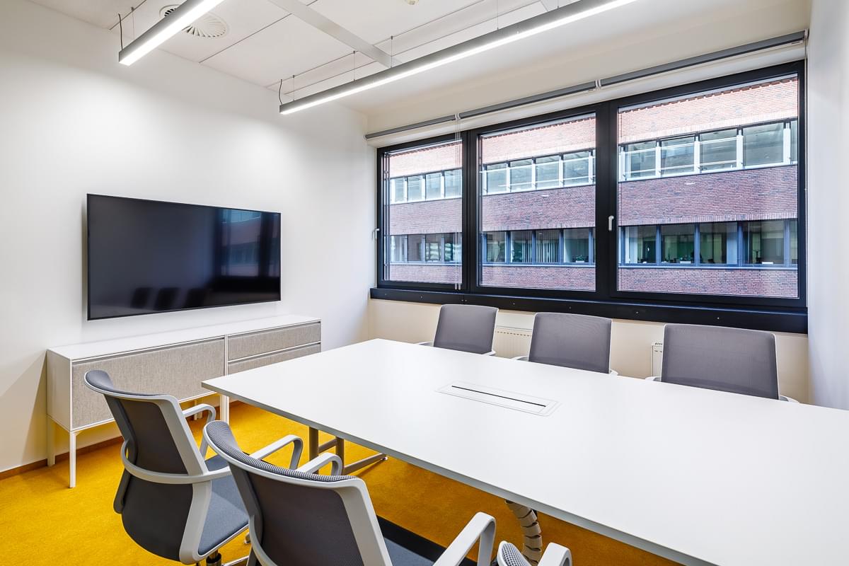 Meeting room in white-yellow colors and TV on the wall