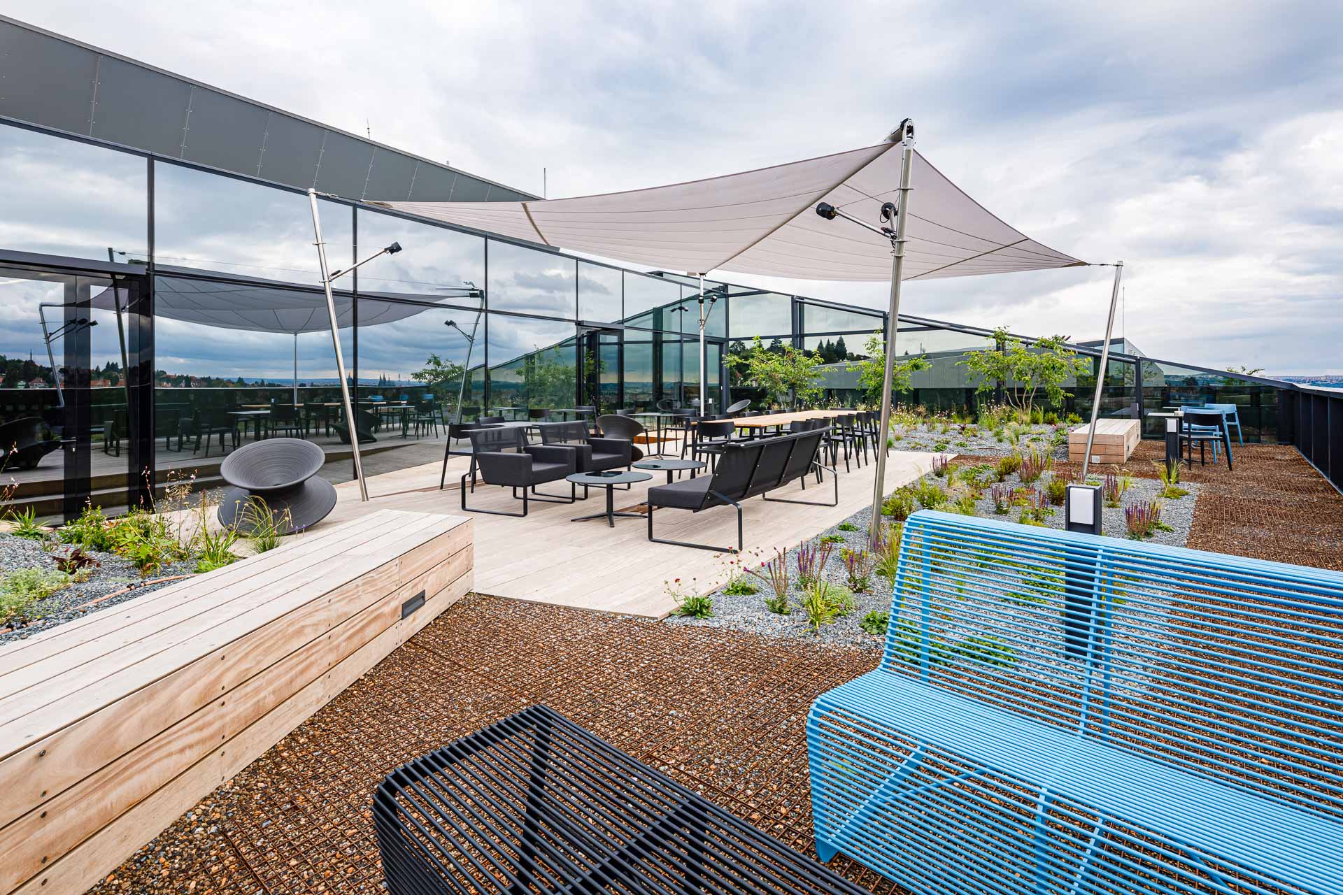 blue bench on the terrace near Bořislavka offices