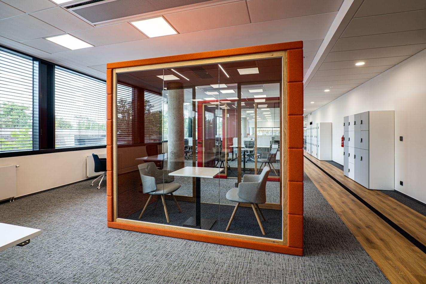 Orange phone booth meeting room for private calls