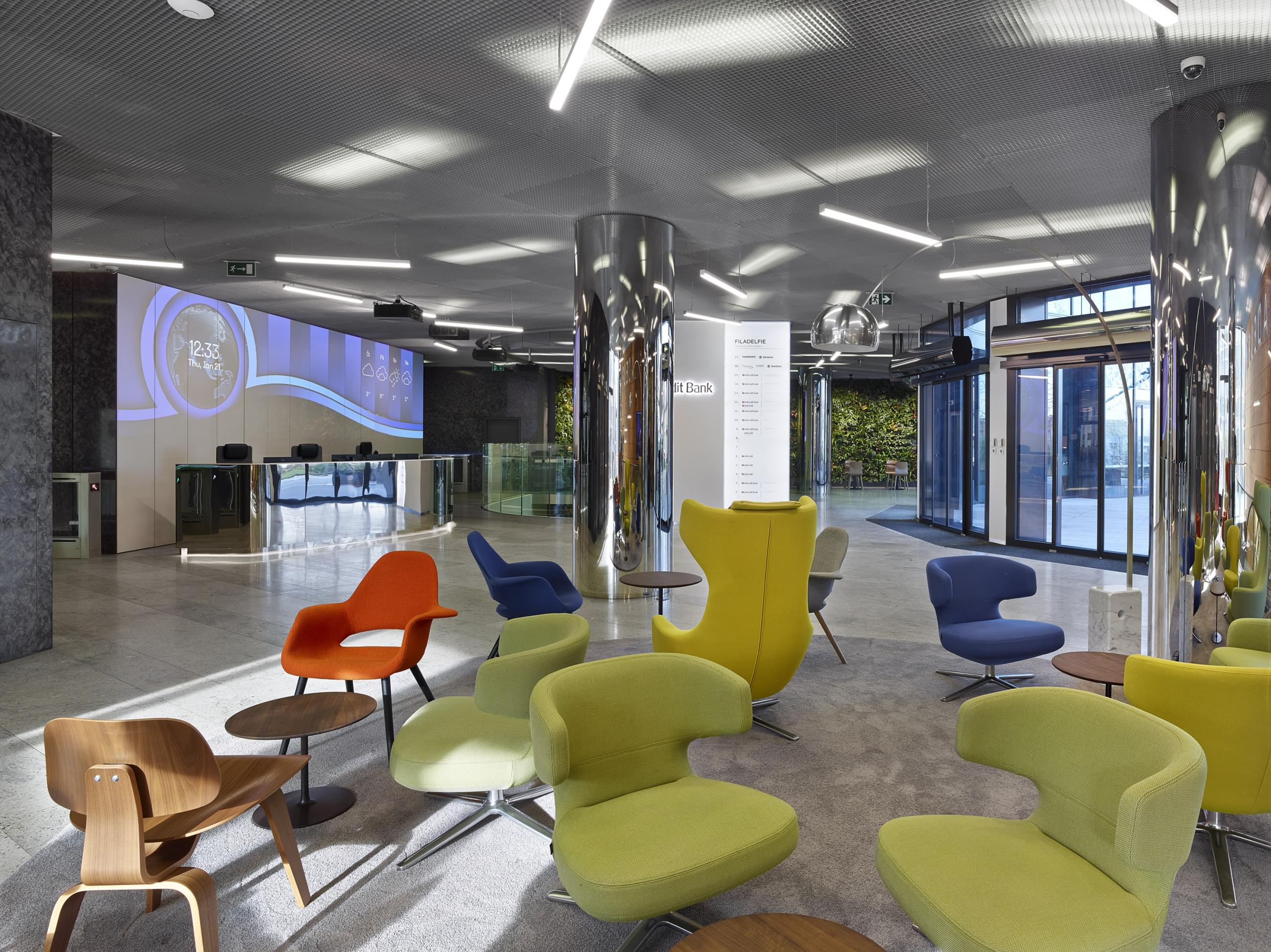 Atypical reception desk with lobby area and comfortable armchairs