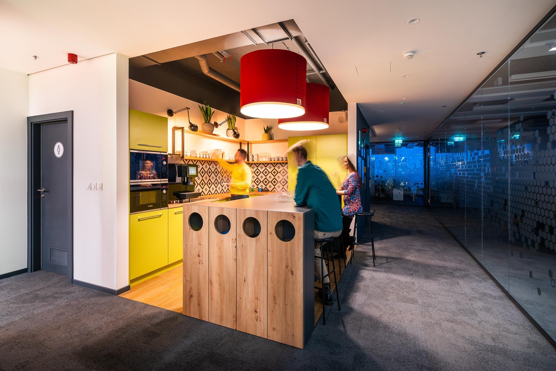 Corporate kitchen in colour and atypical lighting in myhive offices