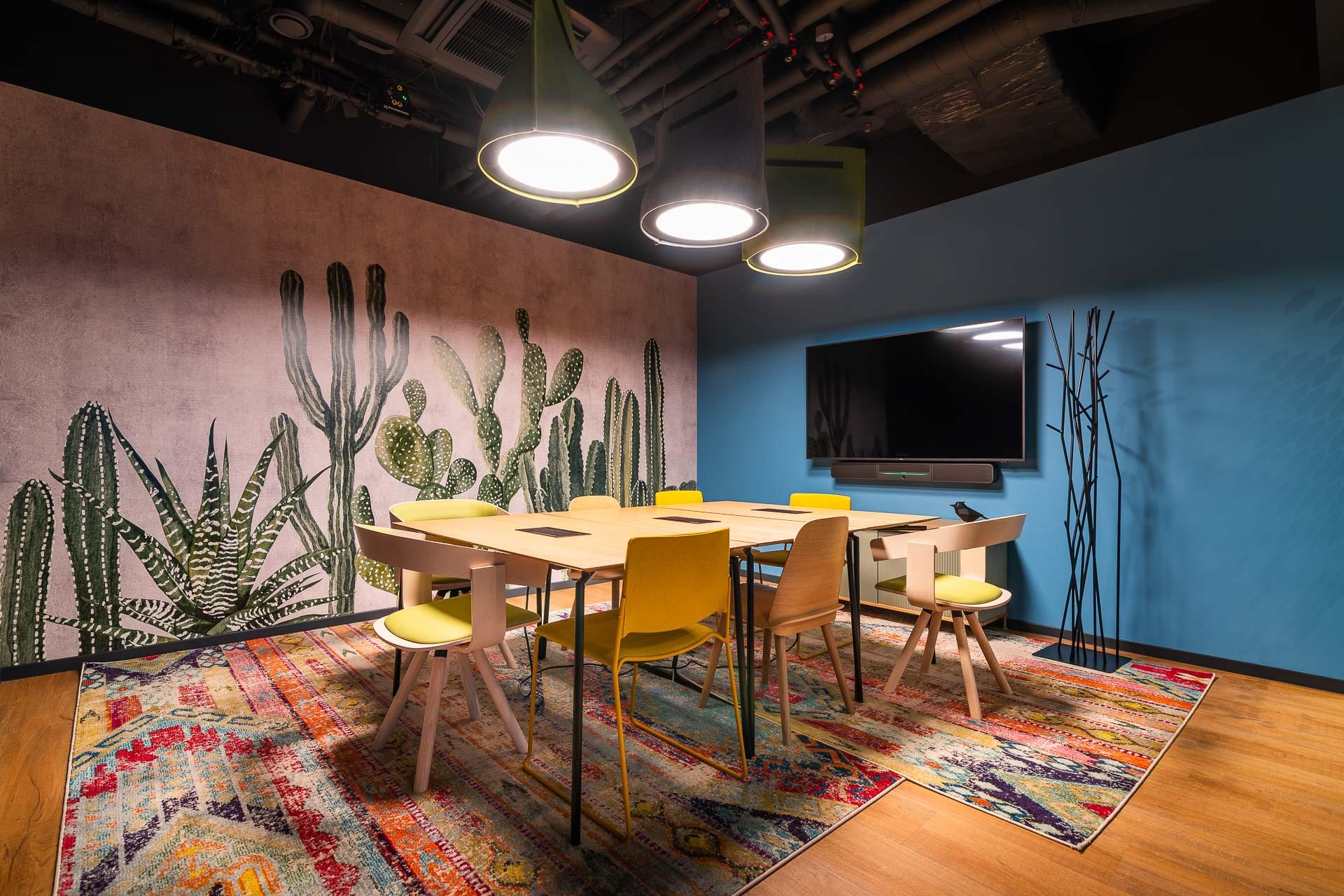 Meeting room with cactus wallpaper and colourful carpet in myhive offices