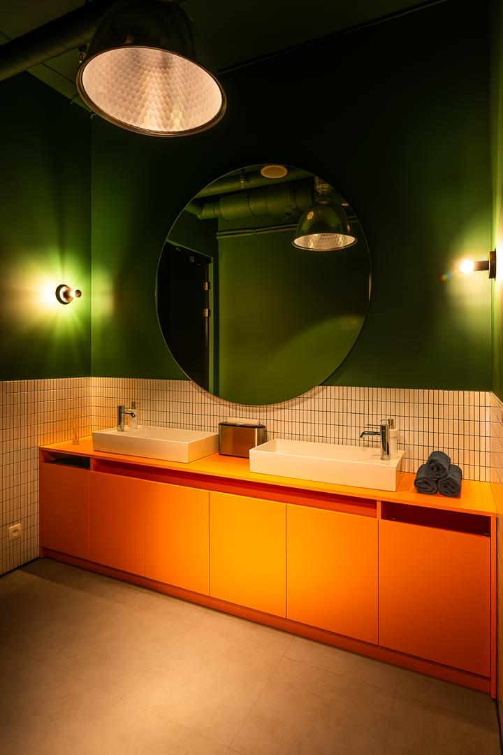 Elegant toilet in emerald green with dimmed lights