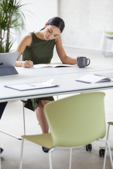 Working woman at adjustable office desk
