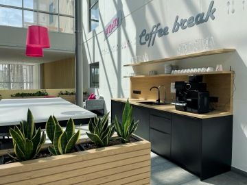 1. T-Mobile café with bar seating and natural elements