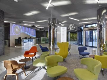 Lobby with modern lighting and comfortable seating for guests