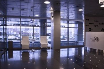 Newly opened Allianz reception at Diamond Point. The reception with large windows overlooking the outside is complemented by white armchairs.