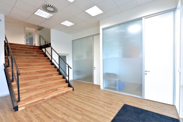 View of the interior of ResMed to individual surgeries and stairs to other parts of ofiice area.