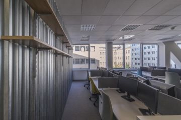 The workplaces of each group are separated by metal lath wall.
