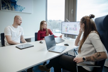 Colleagues in a closed office at a computer