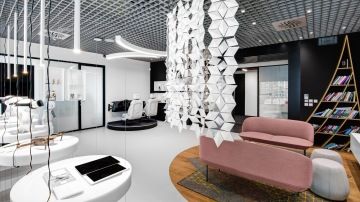 Modern showroom with high tech features and hanging screens from Plexiplast