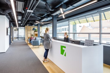 The corporate identity is displayed using a logo at the reception.