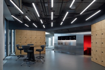 Open office space in EOH IT Hub with wooden storage cabinets