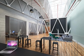 Illuminated space in the Karlín Hall with a white construction and black tables with tasteful simple chairs.
