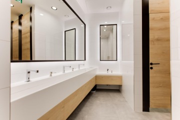 Shot of non-contact washbasins in a modern design with wood elements