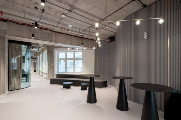 Corridor with exposed ceilings and design features