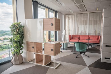 Informal meeting area with comfortable seating and lockers
