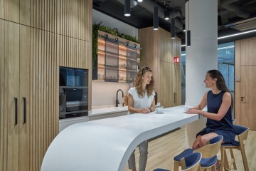 Corporate kitchen with modern equipment in wooden design