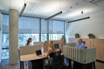 Acoustic separation of the workspace from the bustle of the office