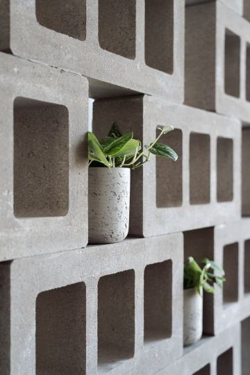 Detail of concrete block with flower pot