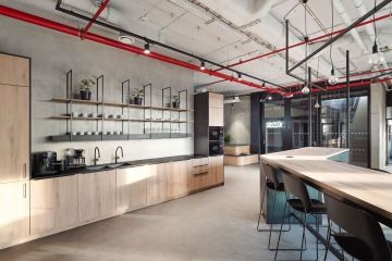 Design kitchen area with bar in a modern office