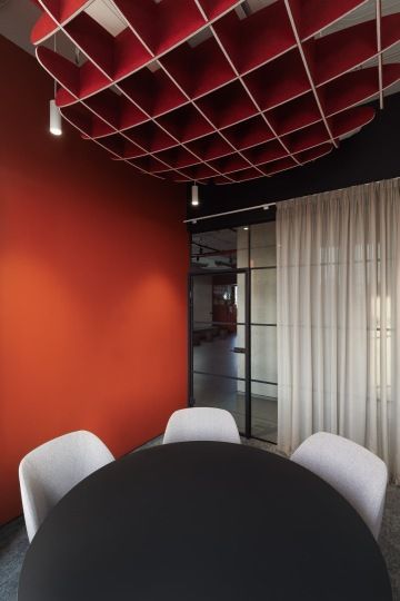 Meeting room with round table and acoustic ceiling
