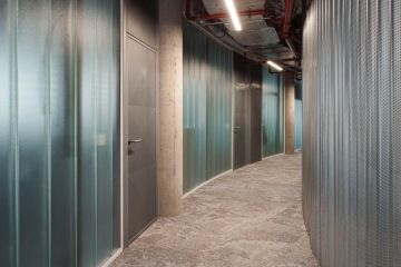 Glass corridor with metal elements
