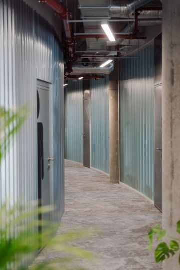 Glass corridor with metal elements