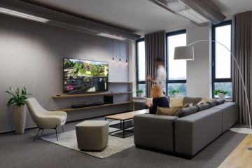 Relax area with sofa and TV in the office space