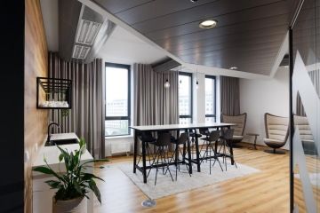 Kitchen with a lowered ceiling and a glass partition with a corporate identity sticker