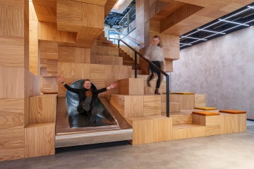 Wooden staircase with slide
