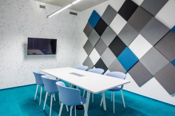 Meeting room at Seznam with acoustic panels on the wall.