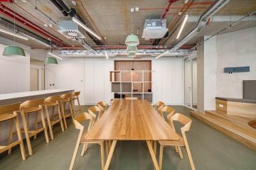 Minimalist corporate kitchen with dining area