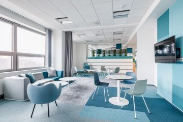 Use of secondary colours and squares motifs together with lockers in the so-called amenities zone of T-Mobile's offices