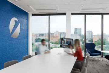 Meeting room in corporate colors and with the UniCredit Bank logo