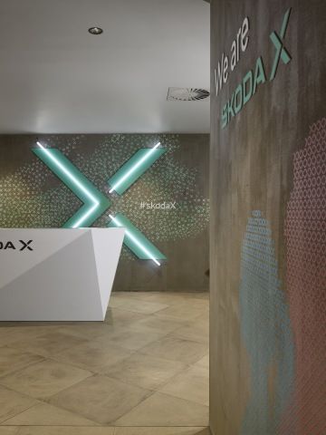 Company reception with wall murals and LED logo