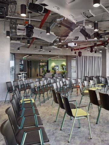 Event zone with ceiling decorations in the form of car roofs