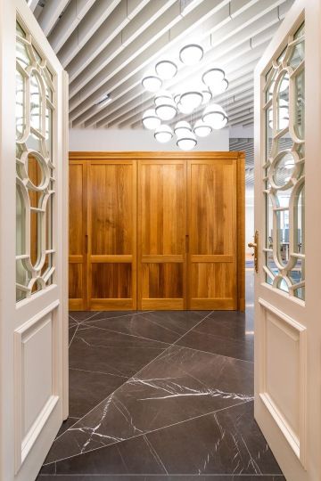 doors to offices with marble and wood