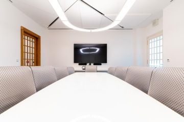 bright meeting room with rounded chandelier