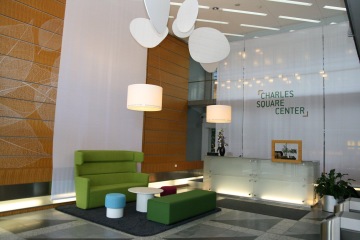 Largest order at the Charles Square Center for Ernst & Young includes a new reception and a set of white sofas in the green.